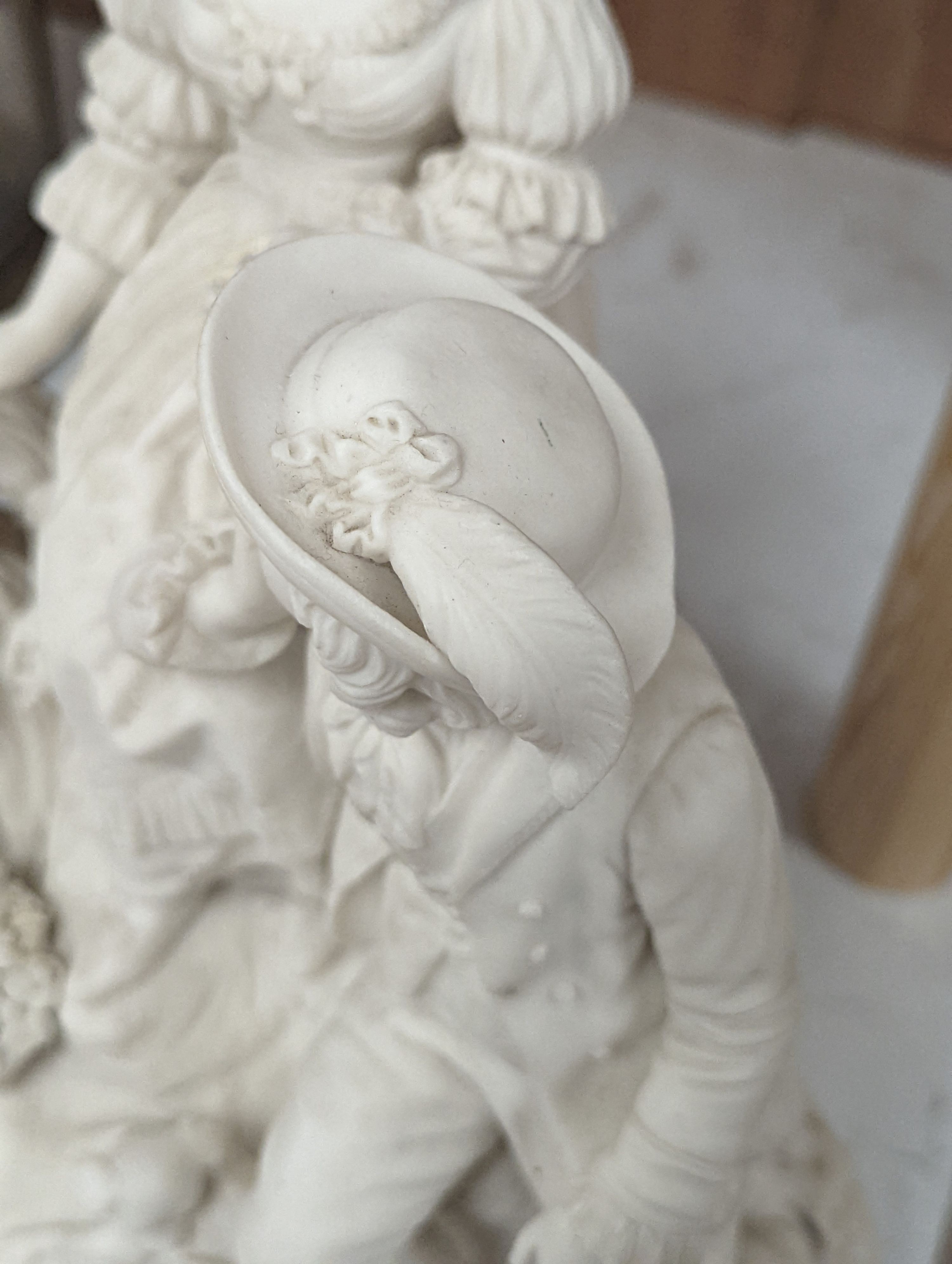 A 19th century Adams & Co. parian group of a man, woman, child and dog 31cm